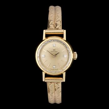 DAMARMBANDSUR, 18 k guld, Omega. omkr 1900-talets mitt. Total vikt ca 24 gram.