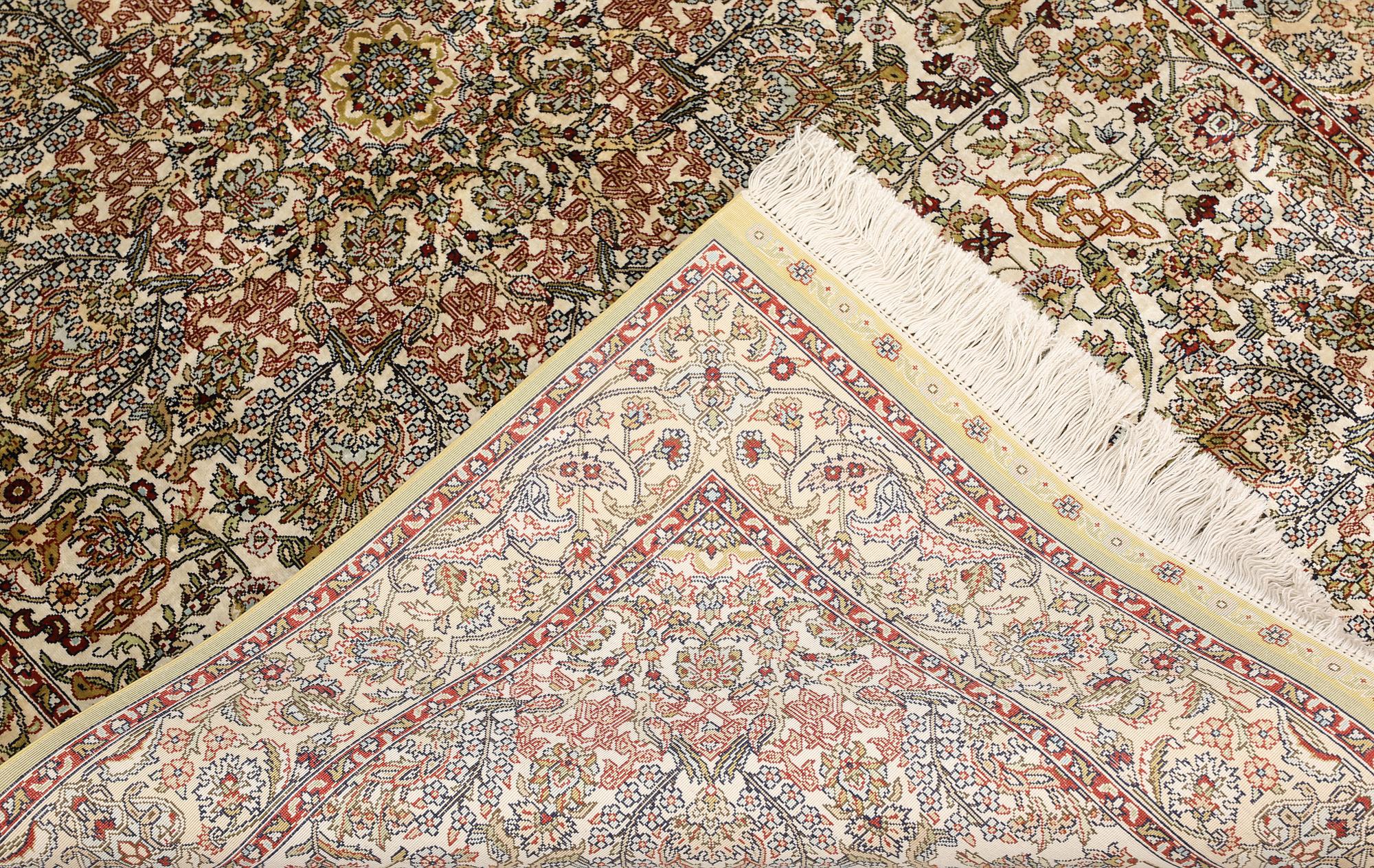 An Oriental silk rug, approx. 153 x 95 cm.