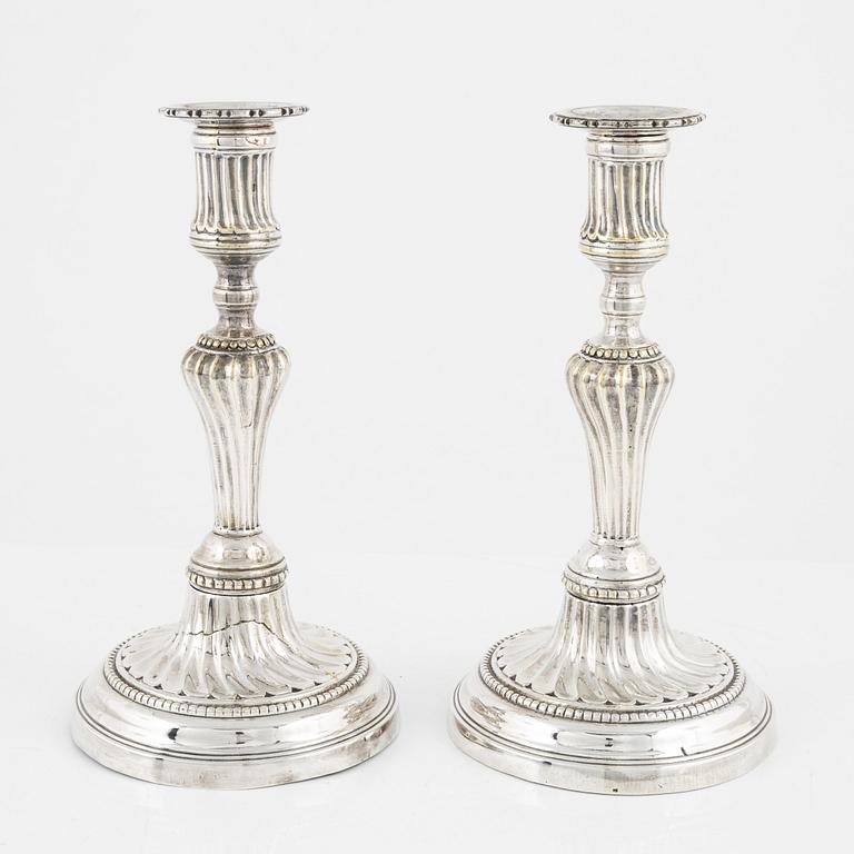 A pair of Louis XVI silvered brass candlesticks, possibly France, 18/19th century.