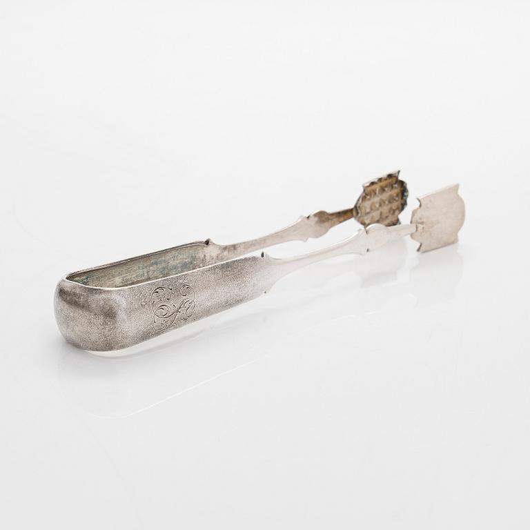 A four-piece silver coffee set, St. Petersburg 1887, original fitted box from Khlebnikov. Sugar tong, Moscow around 190.