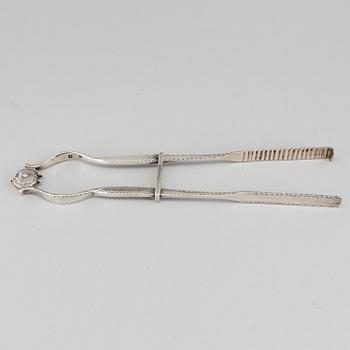 Silver asparagus tongs, England, probably London. Weight 144 grams.