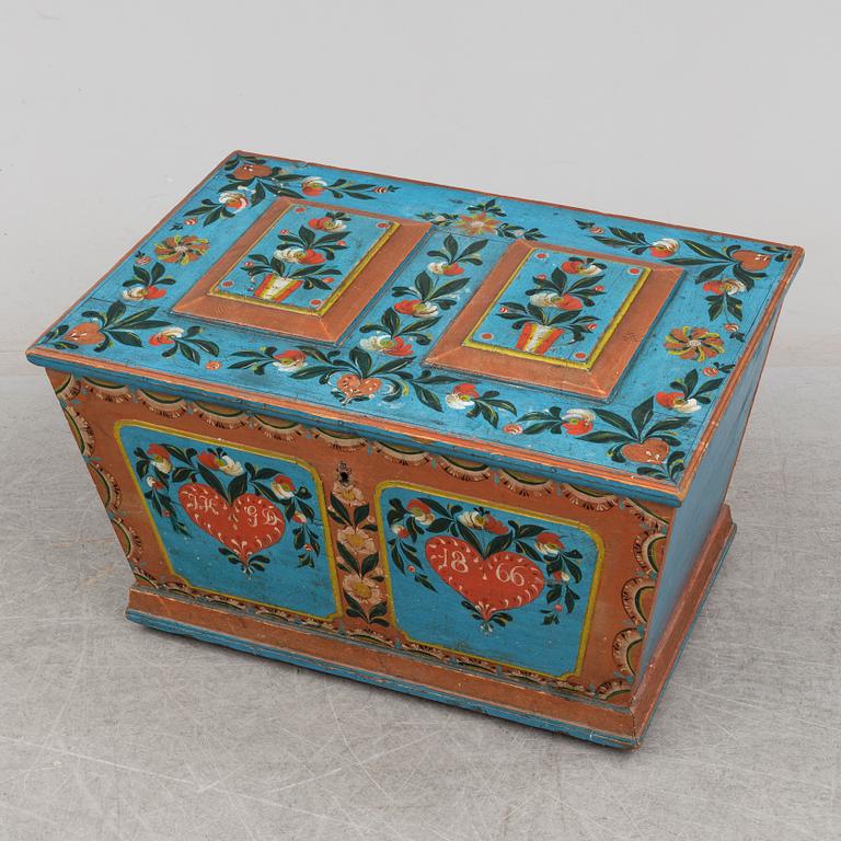 A painted pine chest from Dalsbo, Hälsingland, dated 1866.