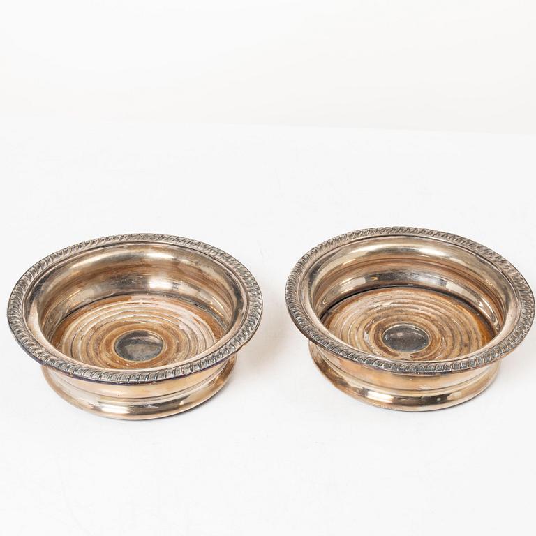 A pair of bottle coasters, silverplate, England.