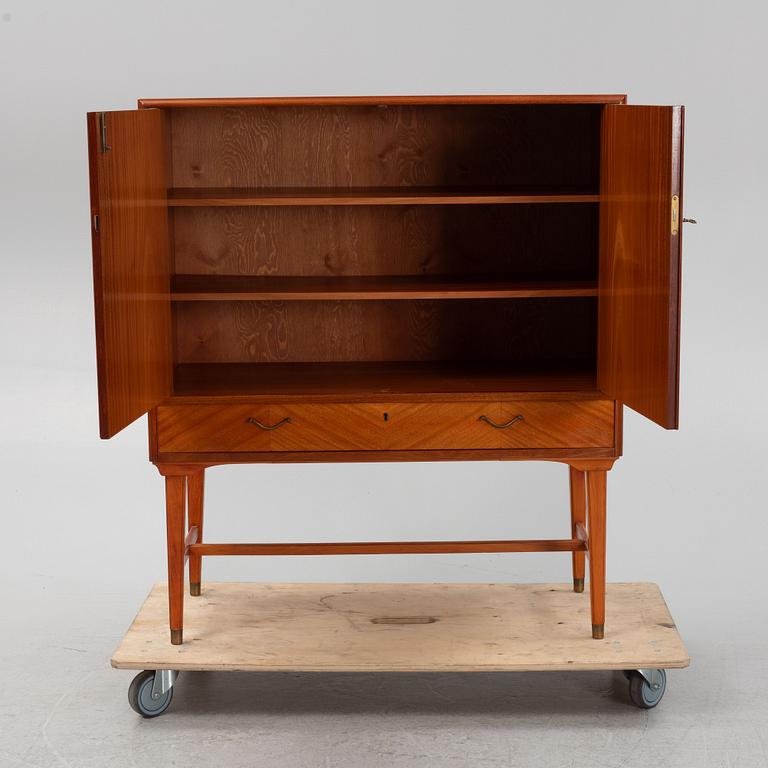 A mahogany veneered cabinet, 1940s/50s.