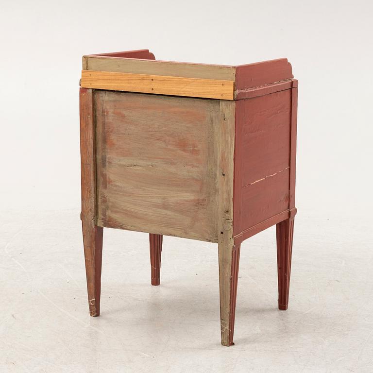 A painted Gustavian bedside cabinet from around the year 1800.