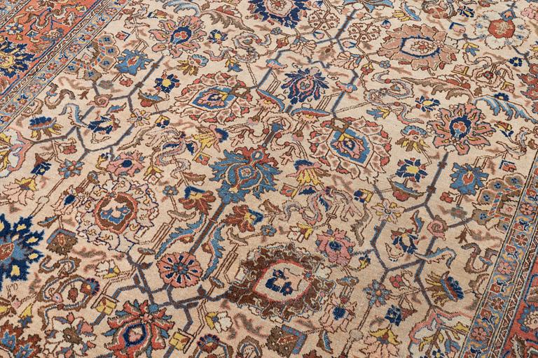 A semi antique Tabriz carpet, c. 290 x 195 cm.