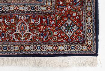A Moud carpet, part silk, signed, c. 345 x 249 cm.