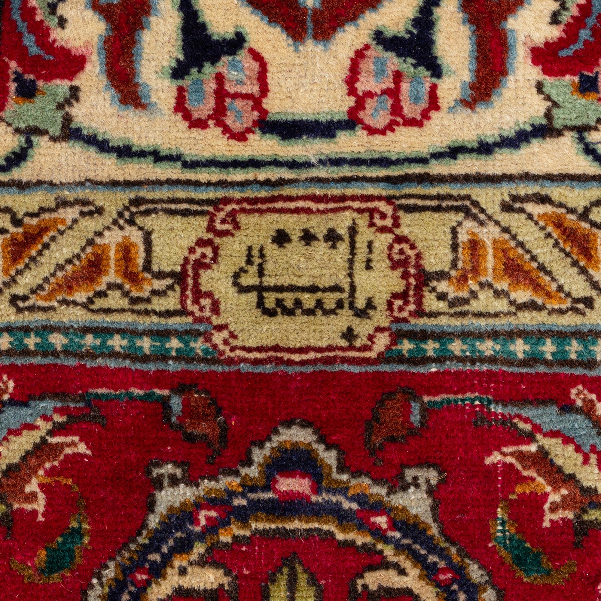 A Tabriz Carpet, circa 316 x 220 cm.