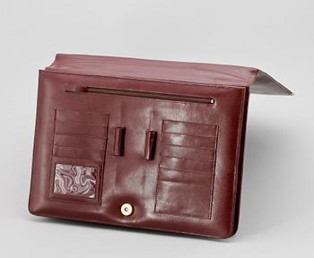 A bordeaux leather brief-case by Cartier.