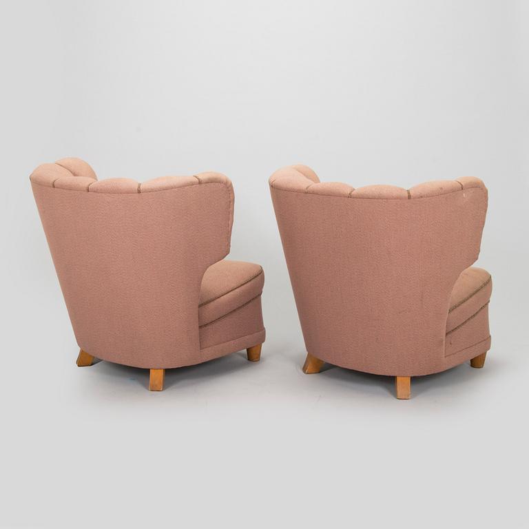 A pair of mid-20th century armchairs.