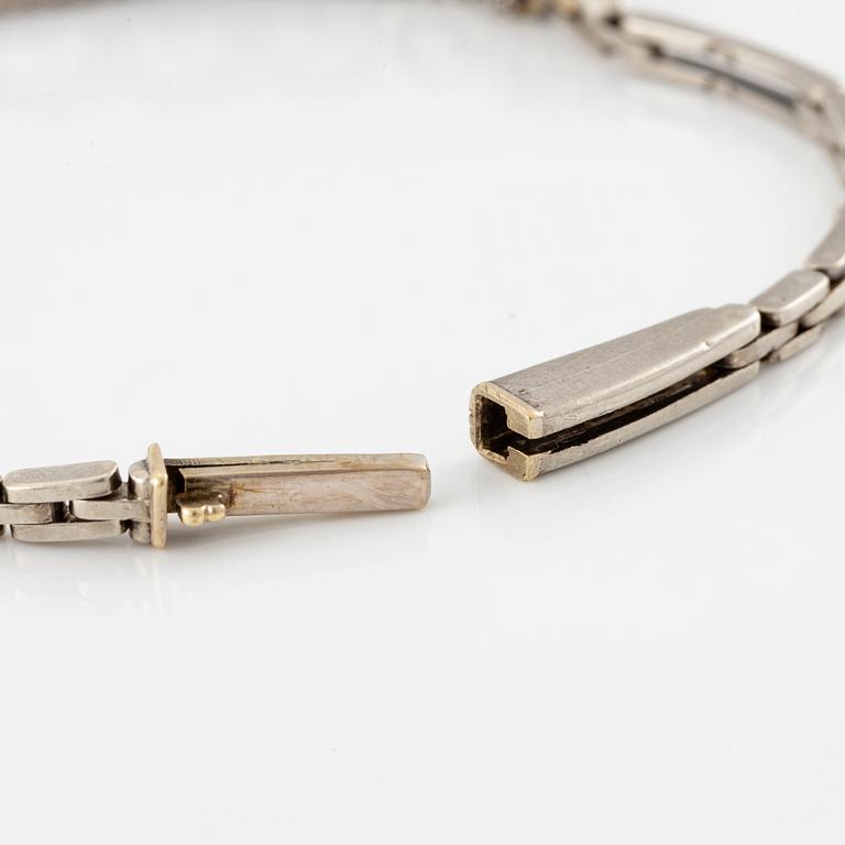 A bracelet in 14K white gold set with old-cut diamonds.
