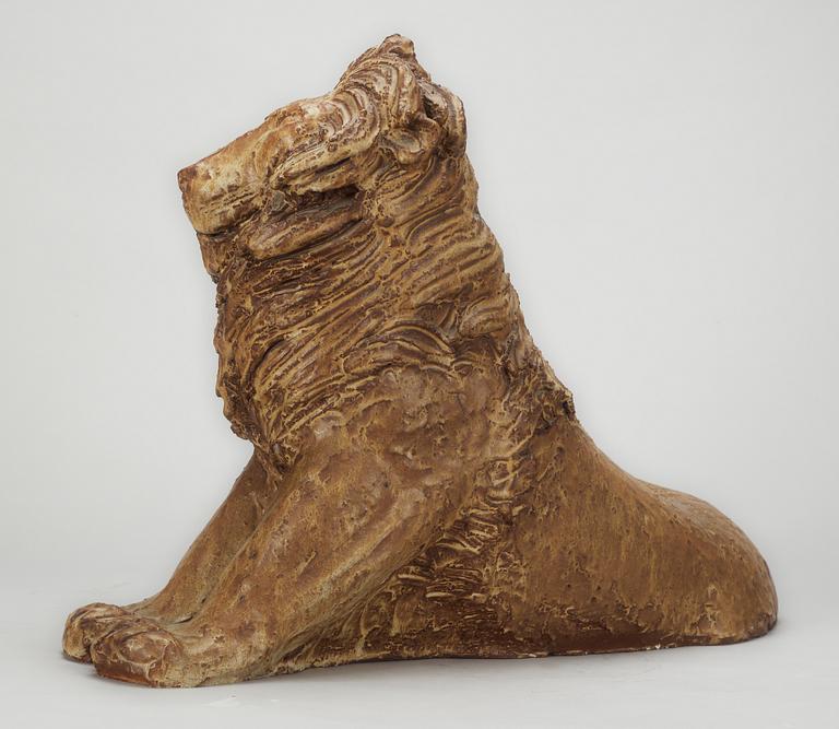 A Michael Schilkin stoneware sculpture of a lion, Arabia, Finland, 1940's.