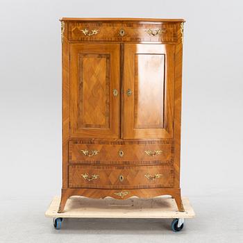 A walnut veneered Louis XV style cabinet, early 20th Century.