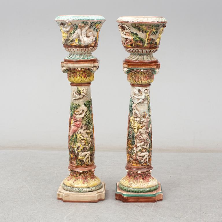 A pair of second half of the 20th century cream ware pedestals with flower pots, Capo di Monte, Italy.