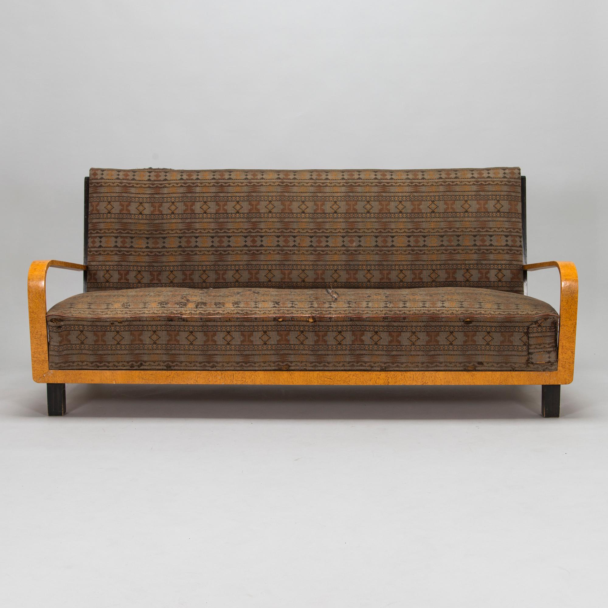 A  1920s Carelian birch veneered sofa.