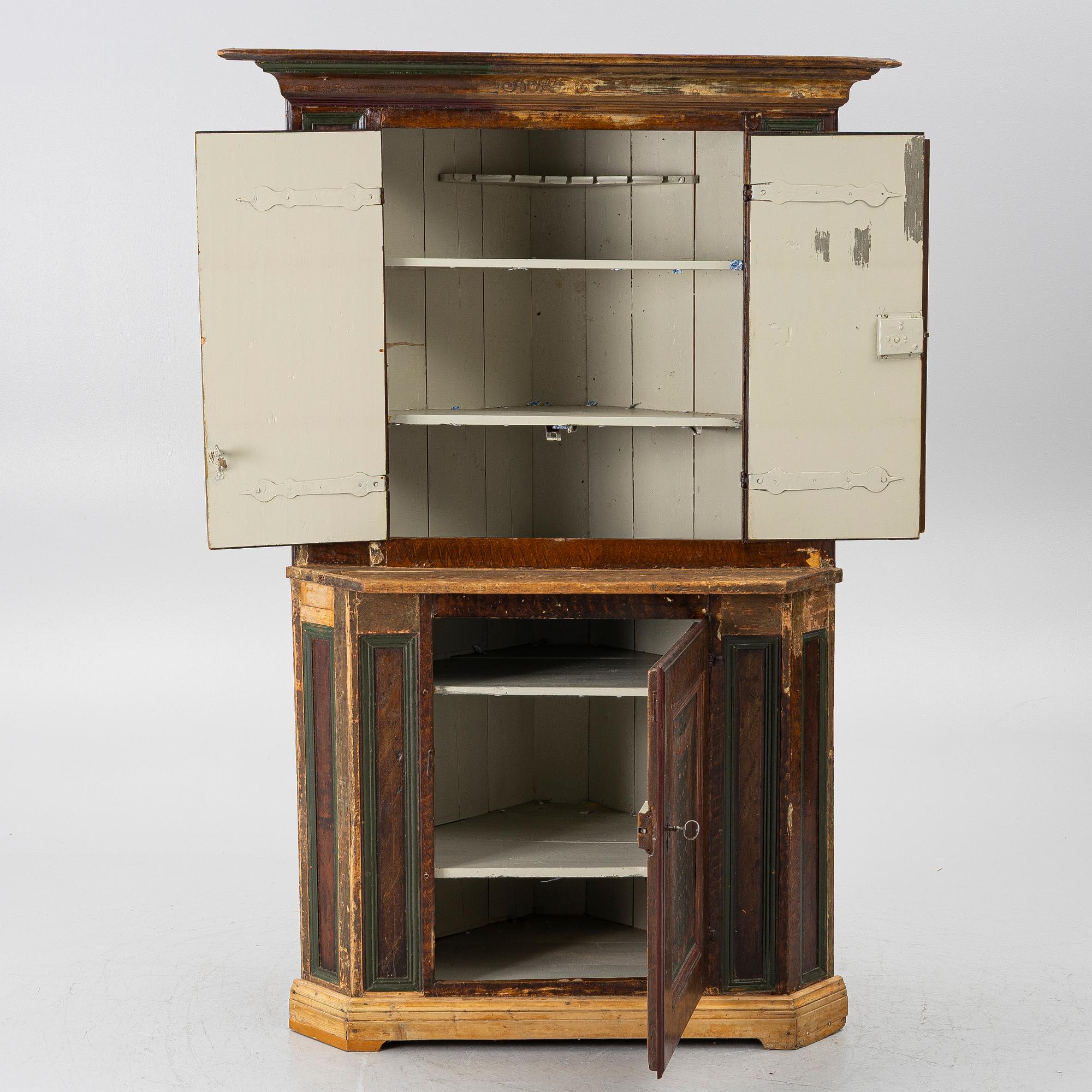 A corner cupboard, dated 1779.