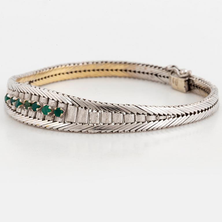 Bracelet with emeralds.