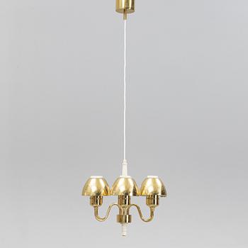 Hans-Agne Jakobsson, a 'T526' brass and wood ceiling light from Markaryd.