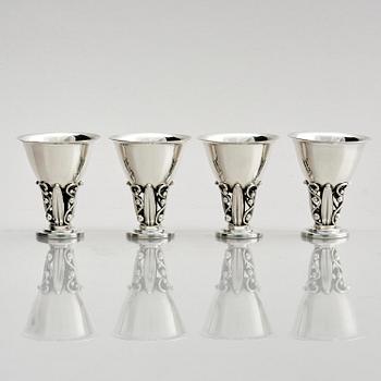 Evald Nielsen, four sterling silver beakers/cups on a foot, Denmark 20th century.