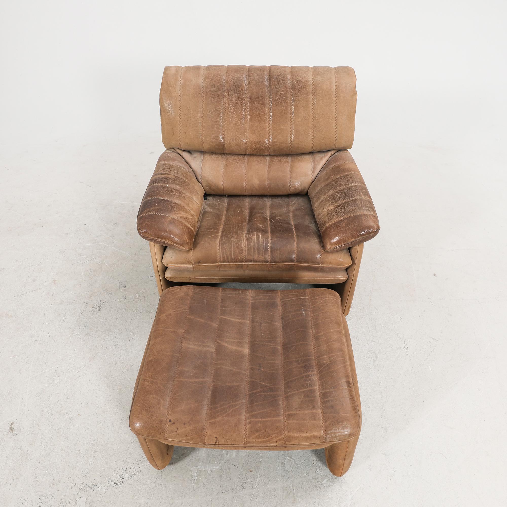 A leather armchair and fotstool by De Sede, Schweiz second half of the 20th century.