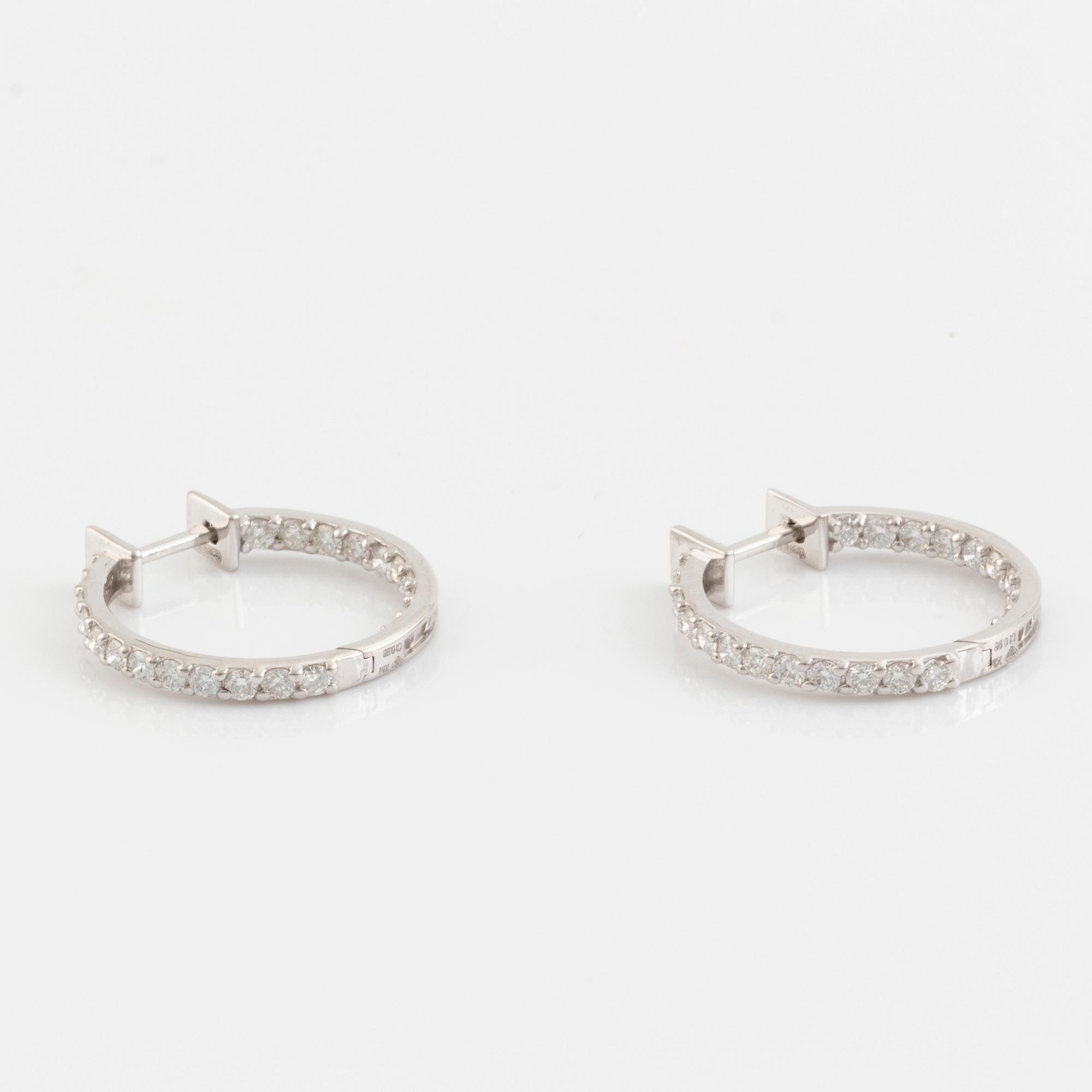 Brilliant cut diamond hoop earrings.