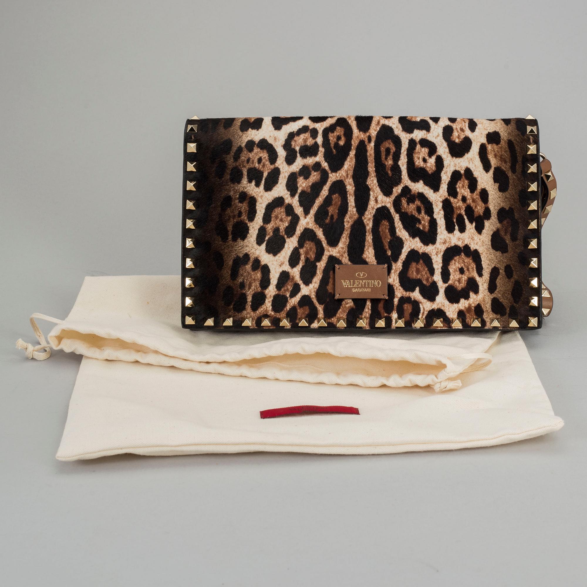 A ponyhair clutch with studs by Valentino.