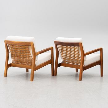 Carl Gustaf Hiort af Ornäs, a matched pair of 'Rialto' lounge chairs, Puunveisto Oy - Träsnideri Ab, Finland, mid-20th century.