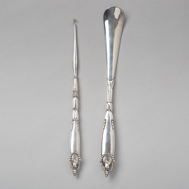 Georg Jensen, a shoehorn and a tool for tying shoe laces, Copenhagen ca 1918-20, 830/ 1000 silver.