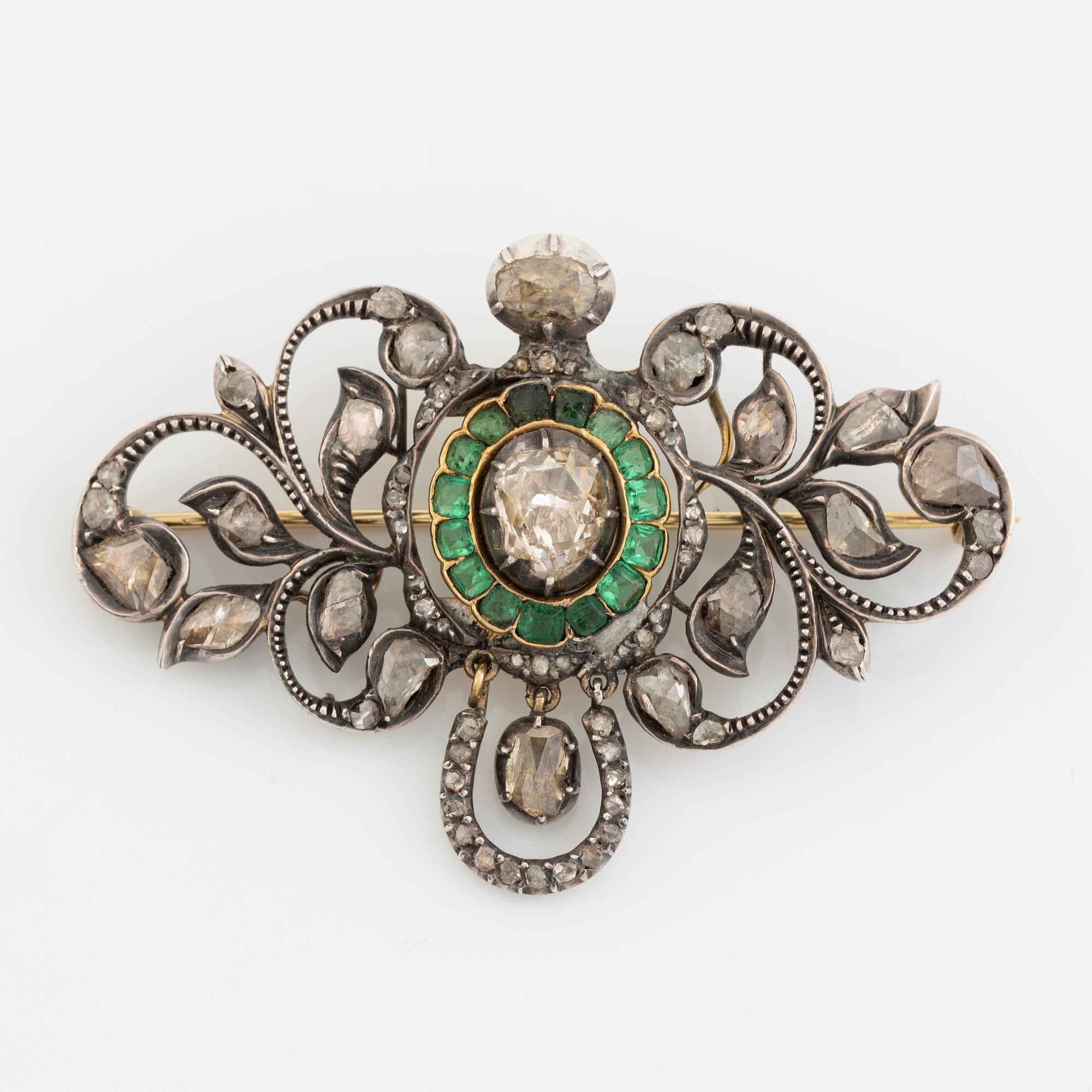 Gold and silver with rose cut diamond and emerald brooch.