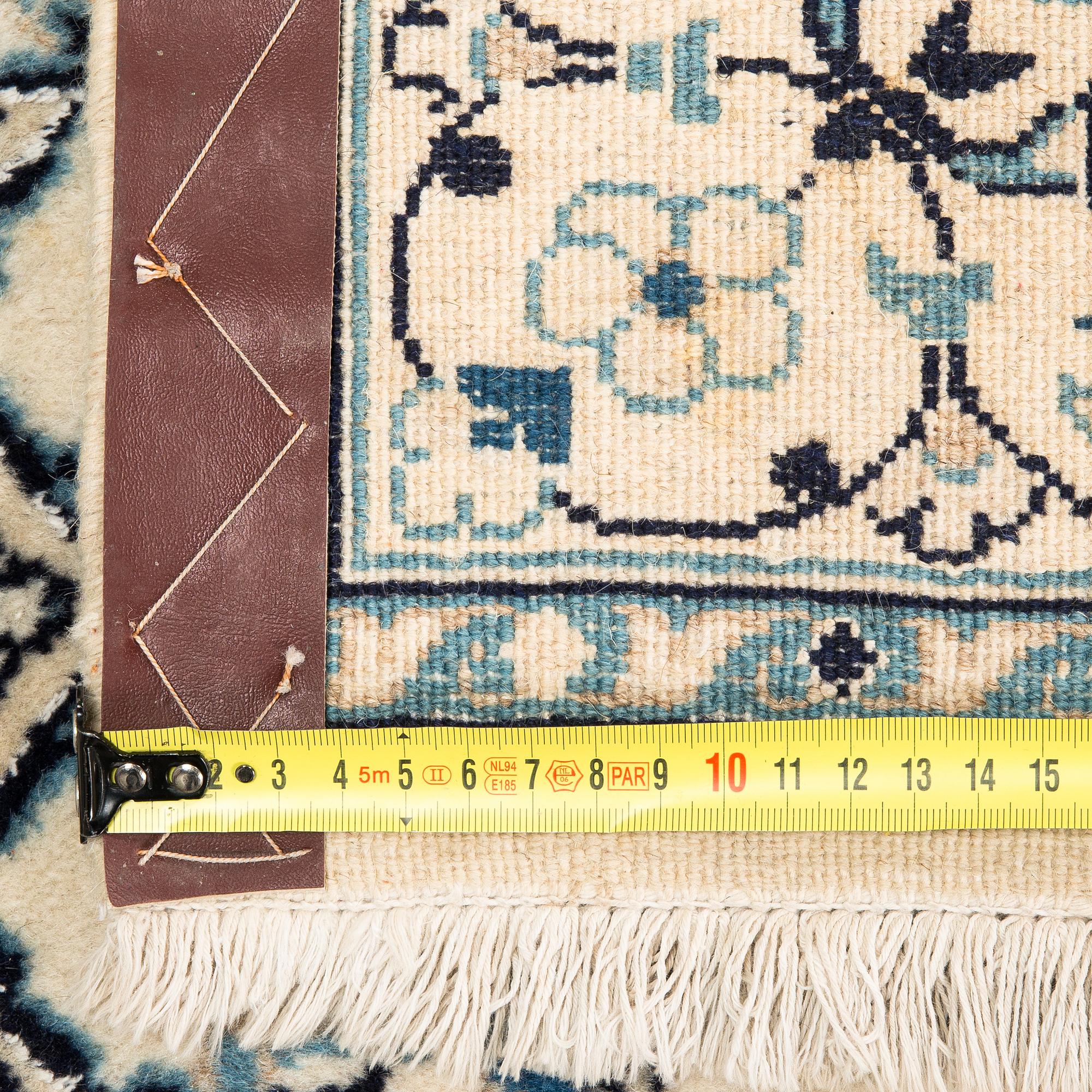 A carpet, Nain Part Silk. Ca 185 x 123 cm.