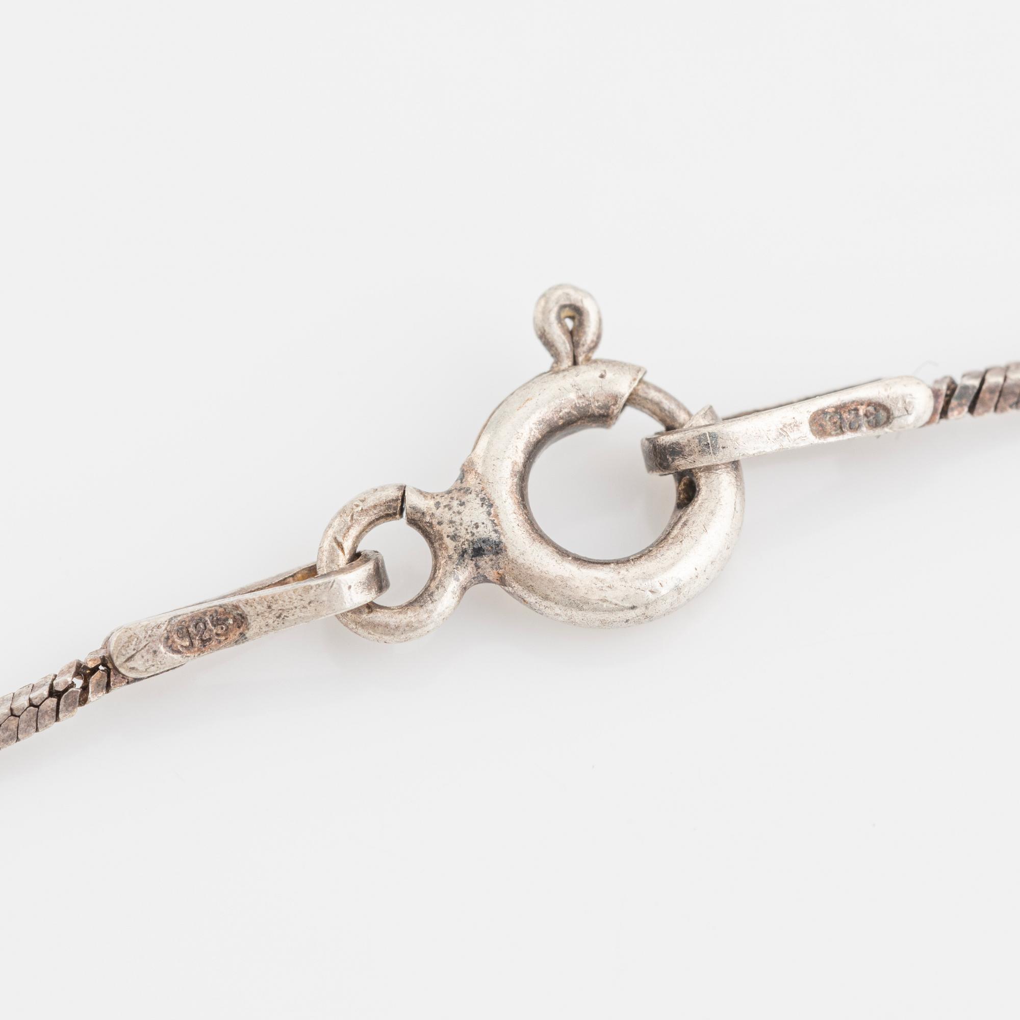 A faceted diamond necklace.