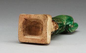 A green glazed figure of a man, Ming dynasty.