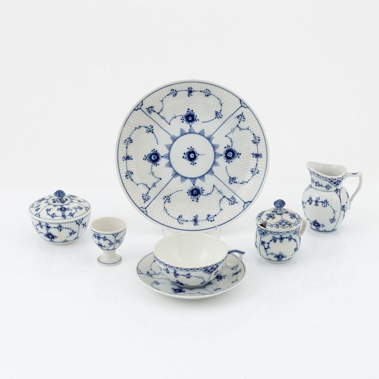 A 24-piece 'Musselmalet' tea service, Rifflet and half lace, Royal Copenhagen, Denmark.