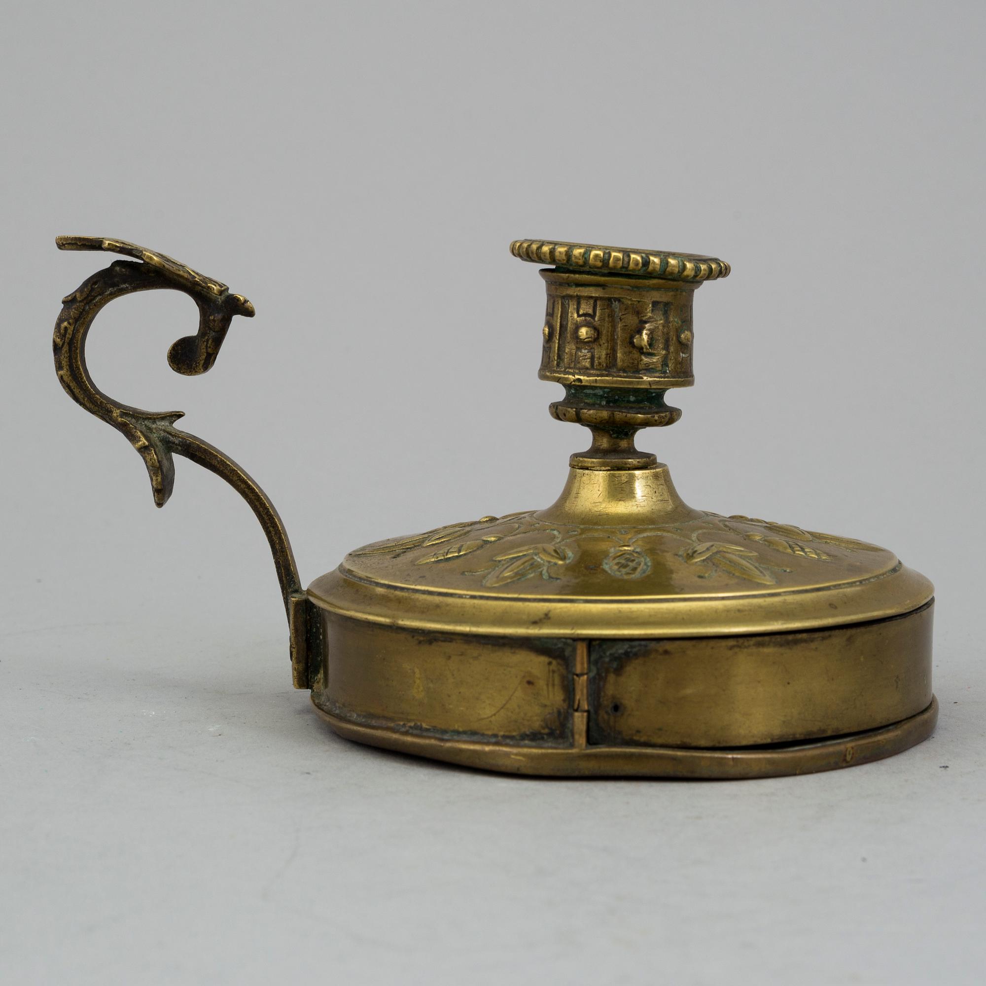 A BRASS NIGHT LIGHT HOLDER, first half of the 19th century.
