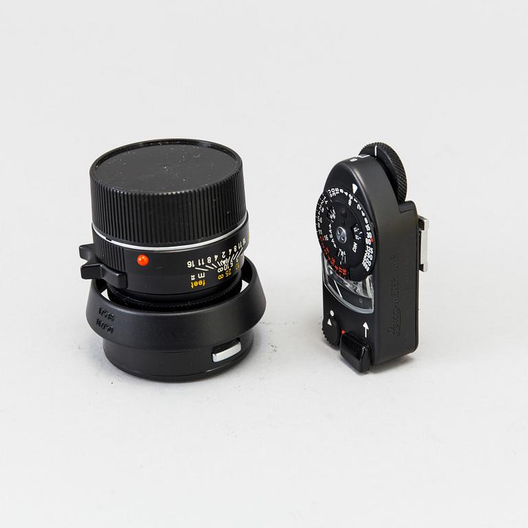 a black body Leica M4-P camera with no 1605951 made by Leitz Canada in 1982. With two lenses and a Leica Meter.
