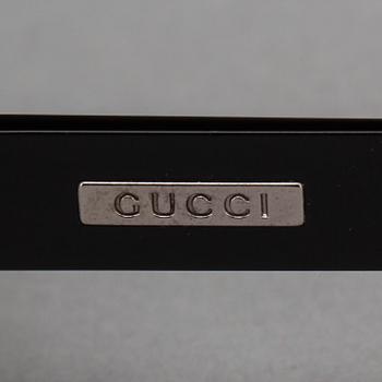 SOLGLASÖGON, Gucci.