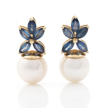 18K gold earrings with cultured Akoya pearls and navette-cut sapphires.
