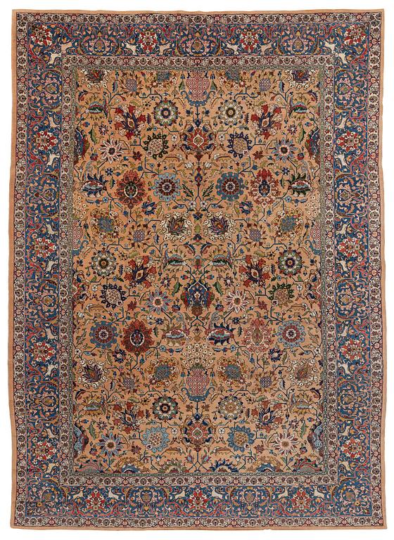 A semi-antique Tabriz carpet of vase design, West Persia, c. 404 x 292 cm.