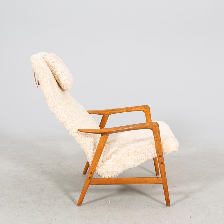 An Alf Svensson Contour-Set 327 sheepskin armchair.