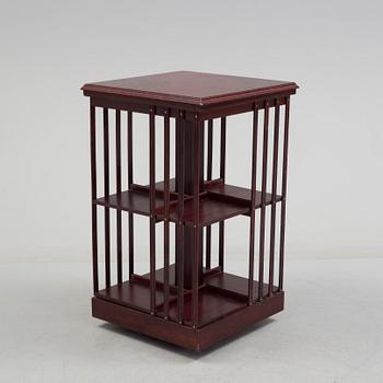 An second half of the 20th century turning book shelf veneered with mahogny.