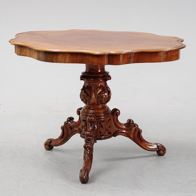 A rococo style sofa, four chairs and a table, second half of the 19th Century.