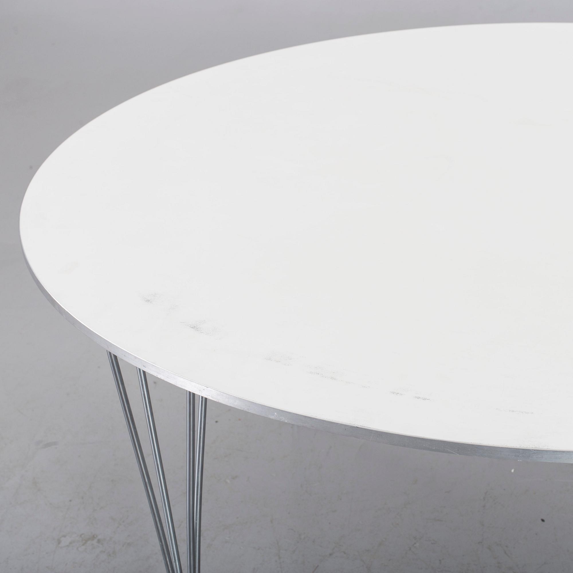 A TABLE BY BRUNO MATHSSON, PIET HEIN & ARNE JACOBSEN FOR FRITZ HANSEN.