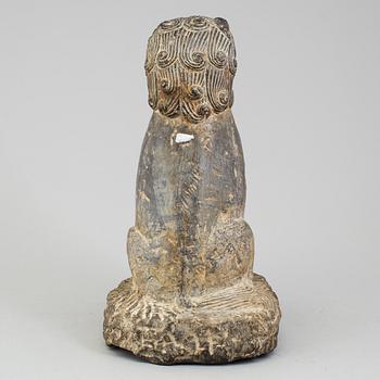 A stone sculpture of a mythical beast, China, 20th Century.