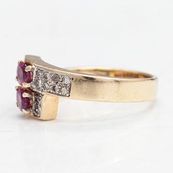 A 14K gold ring with diamonds totaling approx. 0.10 ct in total and rubies. Foreign marks.