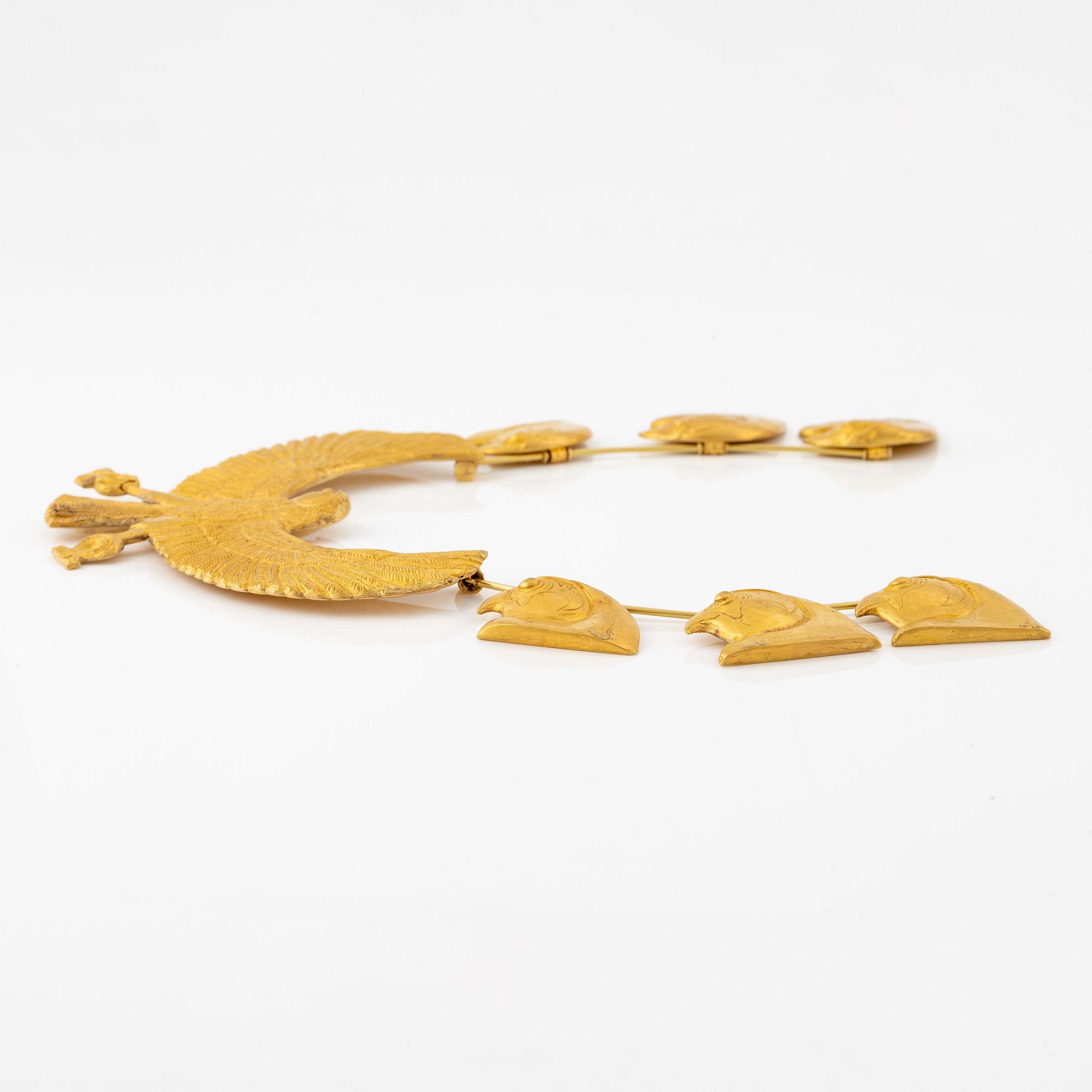 A modern Egyptian-style gold necklace.