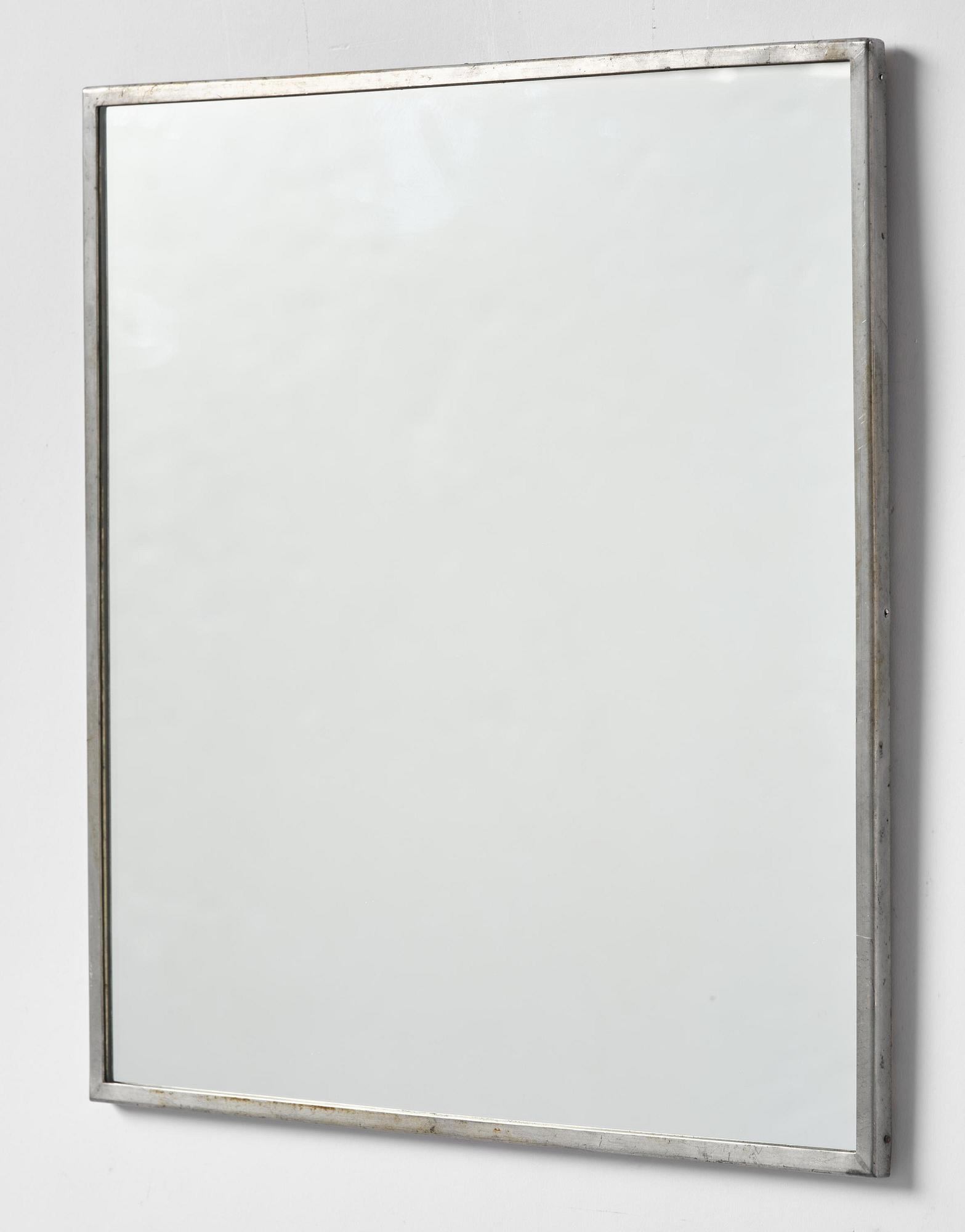 Firma Svenskt Tenn, a pewter wall mirror, Stockholm, 1935.