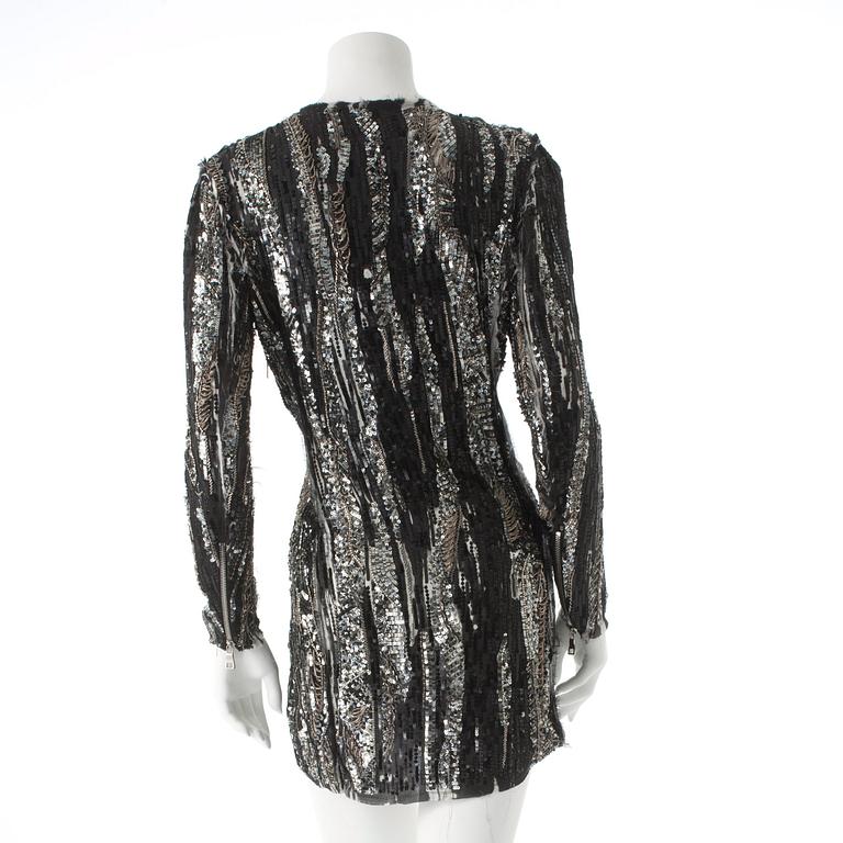 BALMAIN, a black and silver sequin dress.