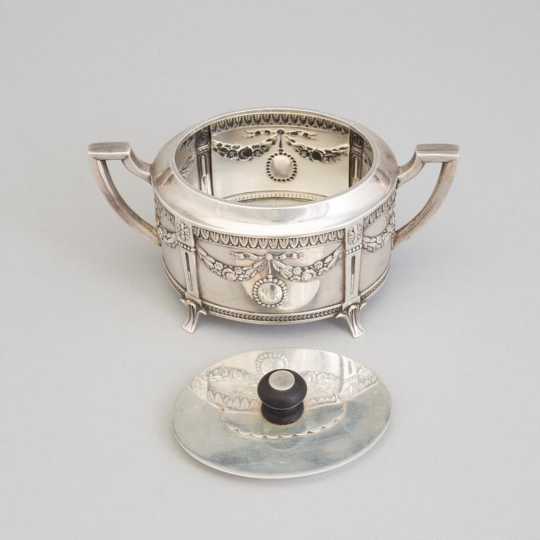 A set of three silver objects (coffeepot, creamer and sugarbowl, CG Hallberg and GAB, Stockholm 1907. Weight ca 1226 gr.