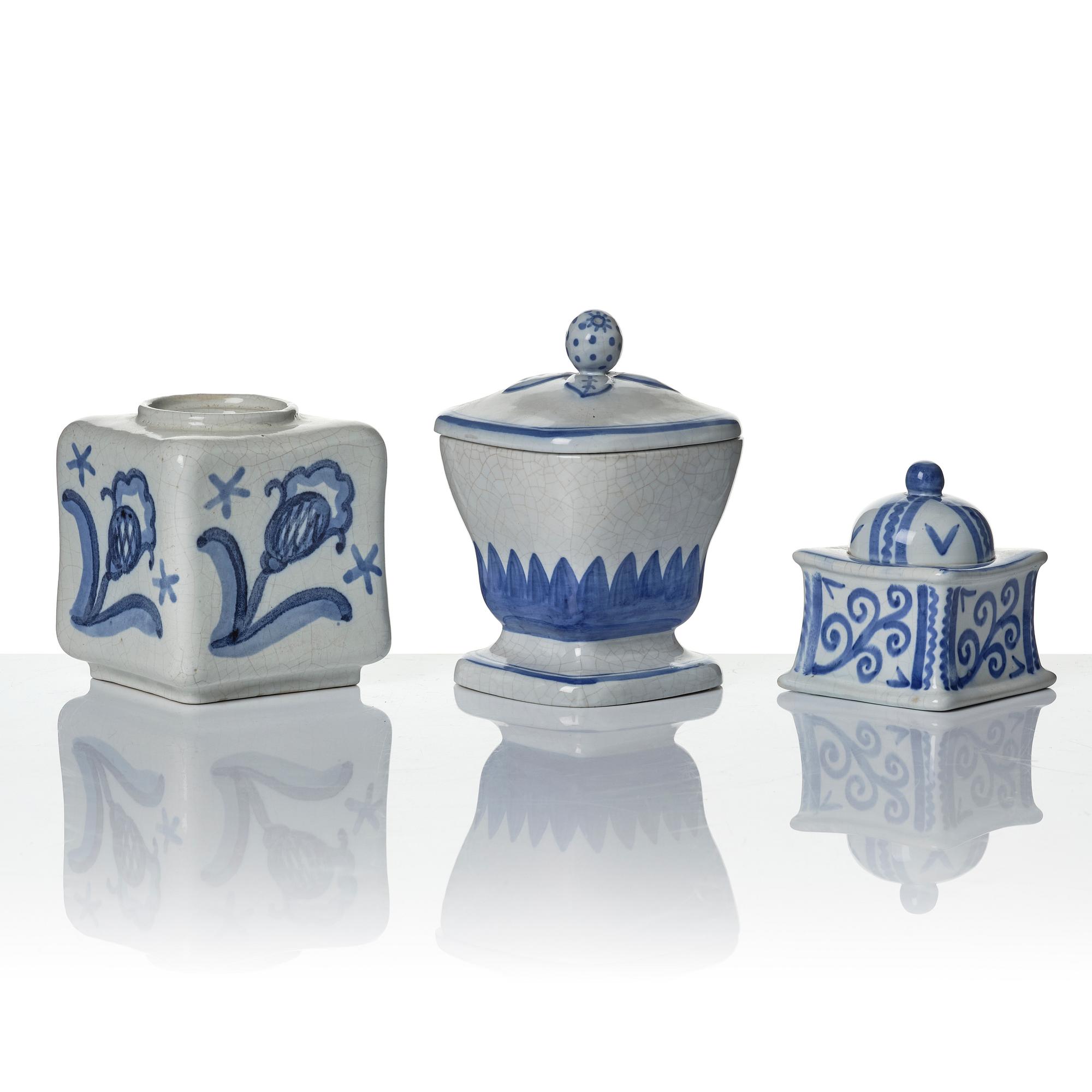Wilhelm Kåge, eleven pieces of faience including jars, inkwells and a tulip vase, Gustavsberg, Sweden, 1919-1920.