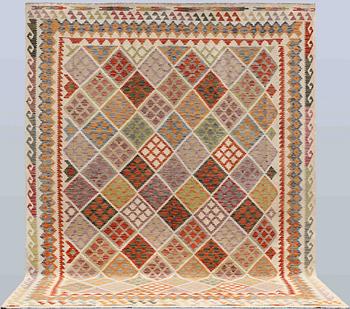 A Kelim carpet, 342 x 270 cm.